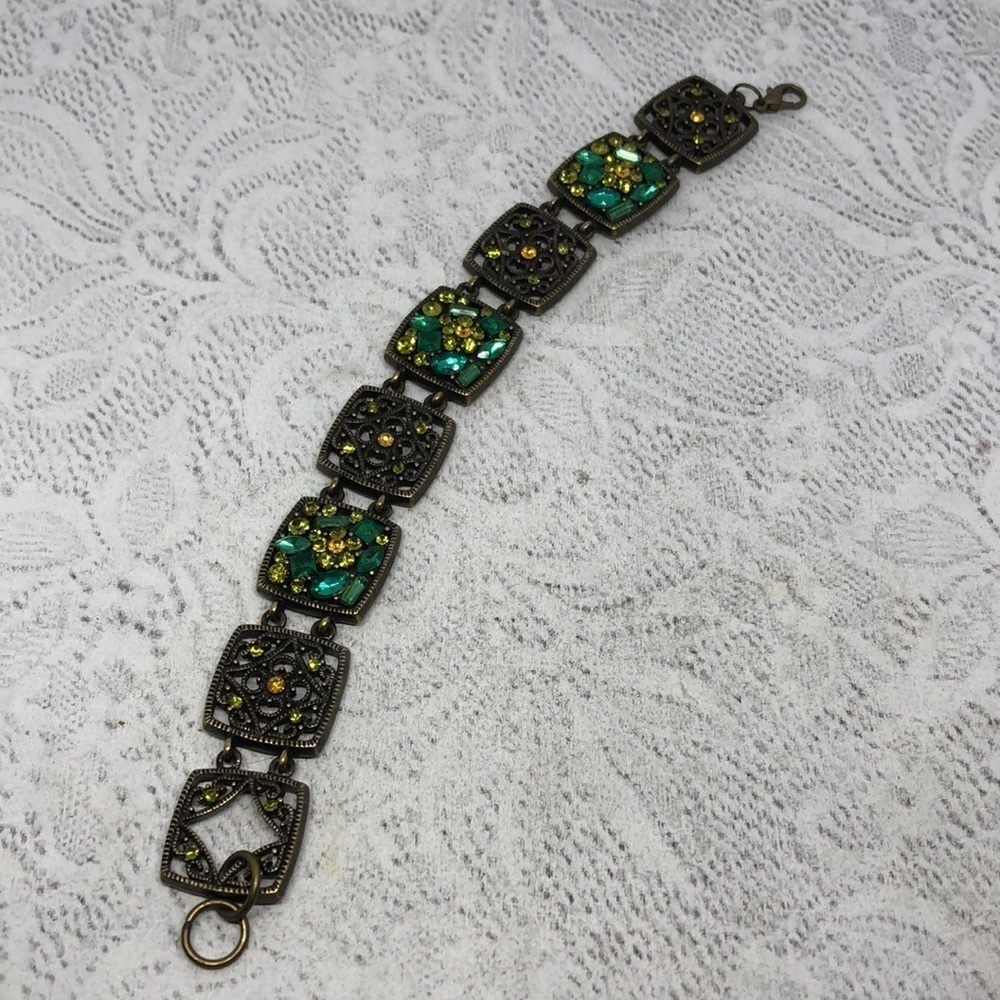 Antique brass tone bejeweled square links sparkling costume statement bracelet.